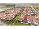 Beautiful aerial view of a residential community showing well-maintained landscaping and tile rooftops at 8742 European Fan Palm Aly, Winter Garden, FL 34787