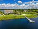 Scenic aerial view of community featuring playground, dock access, and lush green landscaping at 8742 European Fan Palm Aly, Winter Garden, FL 34787