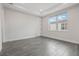 Spacious bedroom featuring plank flooring, bright natural light, and neutral walls at 8742 European Fan Palm Aly, Winter Garden, FL 34787