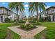 Picturesque neighborhood offering lush greenery, brick-paved paths, and stately townhomes at 8742 European Fan Palm Aly, Winter Garden, FL 34787