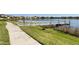 Dock and walking path with a scenic lake view in a residential community at 8742 European Fan Palm Aly, Winter Garden, FL 34787