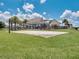 Fun playground with a covered picnic area, a volleyball court, and lush green surroundings at 8742 European Fan Palm Aly, Winter Garden, FL 34787