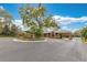 Gated community entrance featuring well-maintained landscaping and architectural details, ensuring privacy and security at 9243 Point Cypress Dr, Orlando, FL 32836