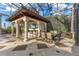 Poolside bar and outdoor dining area complete with a TV, perfect for entertaining guests at 9243 Point Cypress Dr, Orlando, FL 32836