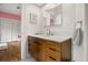 Bathroom featuring wood cabinets and sink at 9308 Thurloe Pl, Orlando, FL 32827