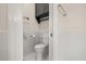 Bathroom featuring marble tile, toilet, storage and shower at 9308 Thurloe Pl, Orlando, FL 32827