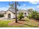 Home's exterior showcasing lush landscaping and walkway leading to the entrance at 9308 Thurloe Pl, Orlando, FL 32827