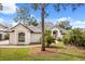 Exterior view of the home displaying its well-maintained lawn and landscaping at 9308 Thurloe Pl, Orlando, FL 32827