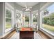 Bright sitting area featuring large windows, comfortable chairs, and natural light at 9308 Thurloe Pl, Orlando, FL 32827