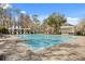 Resort-style swimming pool with lounge chairs and pergola for relaxing in the sun at 9308 Thurloe Pl, Orlando, FL 32827