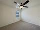 Bedroom with a ceiling fan and a view of the neighborhood at 944 Brooklet Dr, Davenport, FL 33837