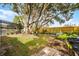 Large backyard with a playset, beautiful trees, and room to enjoy the outdoors at 9729 Heatherwood Ct, Orlando, FL 32825