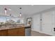Open kitchen with granite countertops and stainless steel appliances at 101 S Eola Dr # 509, Orlando, FL 32801