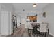 Bright living space featuring wood floors, dining area, and a kitchen with stainless steel appliances at 101 S Eola Dr # 509, Orlando, FL 32801