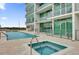 Upscale apartment building with a beautiful pool and jacuzzi for residents to enjoy on a sunny day at 101 S Eola Dr # 509, Orlando, FL 32801
