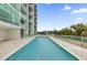 Condo community featuring a large rectangular swimming pool with sleek design and stunning views of the surrounding area at 101 S Eola Dr # 509, Orlando, FL 32801