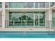Inviting pool area with glass railings and comfortable seating at 101 S Eola Dr # 509, Orlando, FL 32801