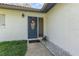 Close-up of the home's front door with decorative wreath and glass panel at 10339 Manila Bay Dr, Orlando, FL 32821