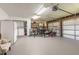 Spacious two-car garage with ample storage, laundry area, and workbench at 10339 Manila Bay Dr, Orlando, FL 32821