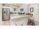 Contemporary kitchen features stainless steel appliances, granite countertops and modern lighting at 10339 Manila Bay Dr, Orlando, FL 32821