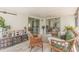 Inviting screened lanai offering a cozy lounge area with comfortable seating and outdoor decor at 10339 Manila Bay Dr, Orlando, FL 32821
