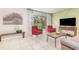 Stylish living room with bright, neutral tones and access to the backyard at 10339 Manila Bay Dr, Orlando, FL 32821