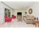 Bright living room with tile flooring, modern decor, and sliding glass door at 10339 Manila Bay Dr, Orlando, FL 32821