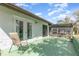 Private patio with a neutral chair and access to the screened lanai, great for outdoor relaxation at 10339 Manila Bay Dr, Orlando, FL 32821
