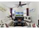 Living room with cathedral ceiling, recessed lighting, and television atop a fireplace entertainment center at 1112 Narcoossee Del Sol Blvd, St Cloud, FL 34771