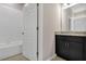 Bathroom with tile flooring, granite countertops, and a shower-tub combo at 1132 Clay Blvd, Tavares, FL 32778