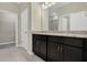 Bathroom with double granite vanity and plenty of cabinets at 1132 Clay Blvd, Tavares, FL 32778