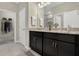 Elegant bathroom with double vanities, granite countertops, and modern fixtures at 1132 Clay Blvd, Tavares, FL 32778