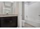 Bathroom with granite vanity and tiled shower-tub combo at 1132 Clay Blvd, Tavares, FL 32778