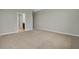 Spacious bedroom with carpet flooring, base trim, and natural lighting at 1132 Clay Blvd, Tavares, FL 32778