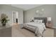 Relaxing bedroom featuring a cozy bed, stylish decor, and ample natural light at 1132 Clay Blvd, Tavares, FL 32778