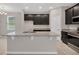 Modern kitchen featuring a large island with sink and breakfast bar seating at 1132 Clay Blvd, Tavares, FL 32778