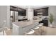Modern kitchen featuring stainless steel appliances, granite countertops, and a central island with seating at 1132 Clay Blvd, Tavares, FL 32778