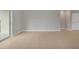 Open-concept living room with tile floors and sliding glass doors at 1132 Clay Blvd, Tavares, FL 32778