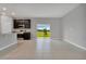 Bright living room features tile flooring, natural light from the sliding glass doors to the backyard at 1132 Clay Blvd, Tavares, FL 32778