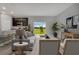 Bright living space with sliding glass doors and a seamless transition to the kitchen at 1132 Clay Blvd, Tavares, FL 32778