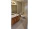 Neutral bathroom with vanity, toilet, and shower/tub combo at 12151 Goldenstar Ln, Clermont, FL 34711