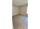 Bedroom with new floor and a window at 12151 Goldenstar Ln, Clermont, FL 34711
