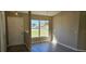Inviting dining room with a large window, modern flooring, and a stylish pendant light fixture at 12151 Goldenstar Ln, Clermont, FL 34711