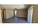 Spacious living room with modern flooring, ceiling fan, and sliding glass doors for natural light at 12151 Goldenstar Ln, Clermont, FL 34711