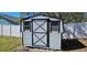 Small shed with windows and door at 12151 Goldenstar Ln, Clermont, FL 34711