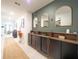 Hallway with stylish built-in storage cabinets, decorative mirrors and modern lighting at 1217 Michelangelo Ln, Winter Haven, FL 33884