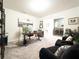 Bright home office with stylish desk, black arm chairs, and modern decor at 1217 Michelangelo Ln, Winter Haven, FL 33884