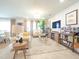 Bright, open concept living room with large windows and stylish decor and large sectional sofa at 1217 Michelangelo Ln, Winter Haven, FL 33884