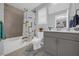 Clean bathroom featuring a shower/tub combo, toilet, vanity, and modern fixtures at 1240 Lone Palm Way, St Cloud, FL 34771