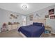 Spacious bedroom with a large bed and windows allowing for natural light at 1240 Lone Palm Way, St Cloud, FL 34771